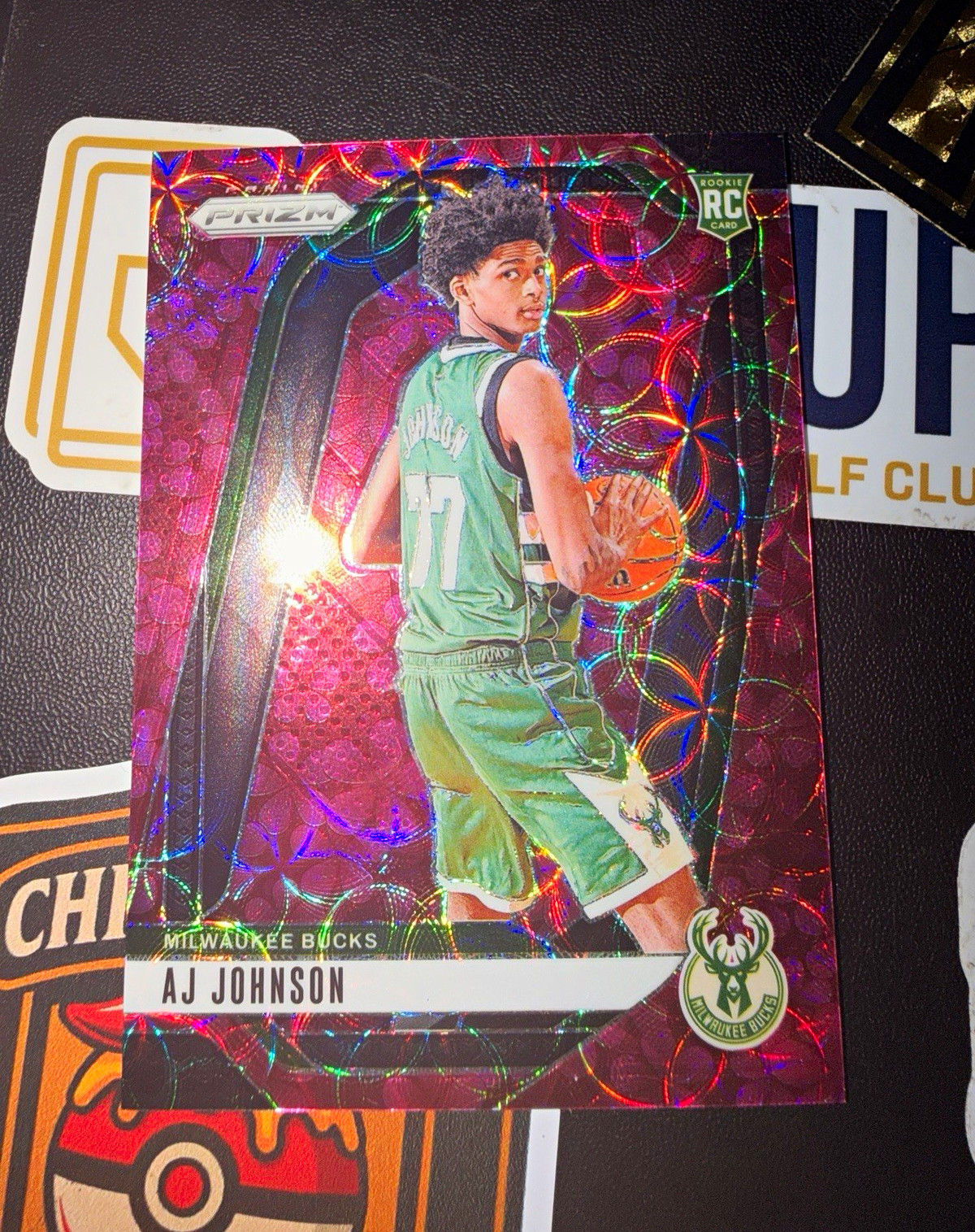 2024-25 PANINI PRIZM AJ JOHNSON PLUM BLOSSOM PRIZM /8 RC BUCKS #251