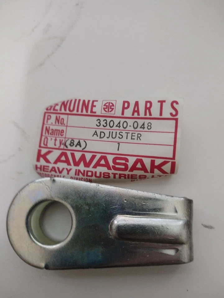 Ajustador de cadena Kawasaki 33040-048 F7 nuevo de colección Foto 2 de 2