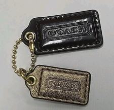 Coach Gold Tone And Leather Key Tag Pair