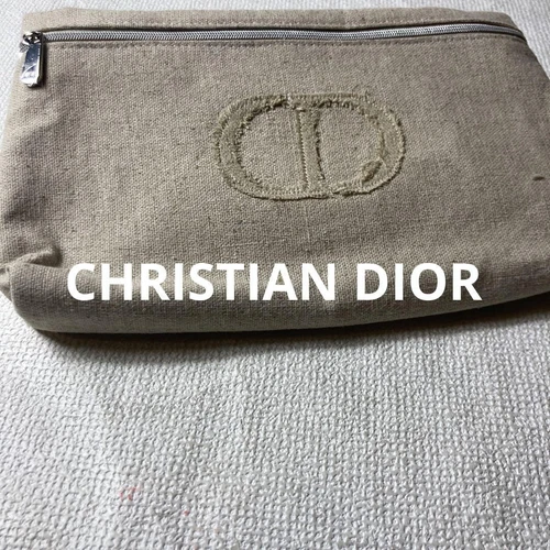 Pochette tissu beige Dior doux léger état d'usage accessoire élégant