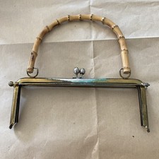 24cm  A vintage misppro metal purse frame with a bamboo handle and kiss clasp. 