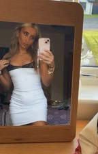 White bodycon mini dress with strappy lace trim