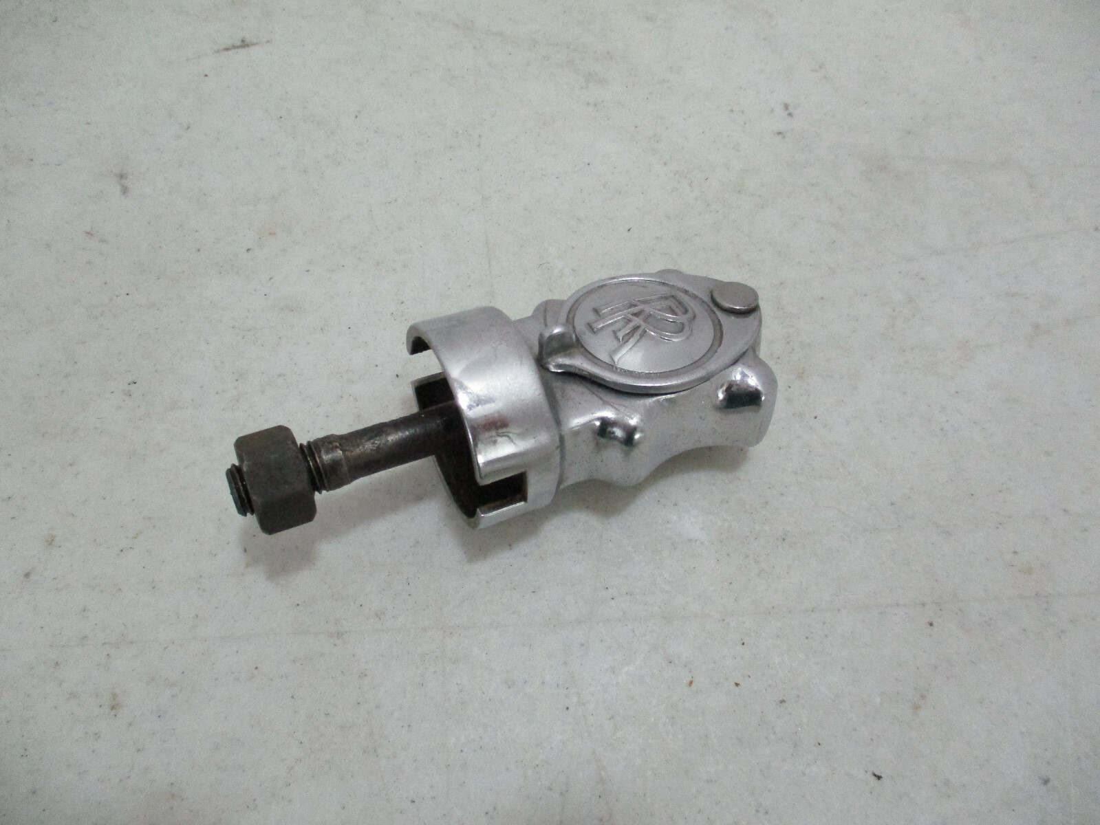 Vintage Rolls-Royce Phantom III starting crank guide under the center spot light