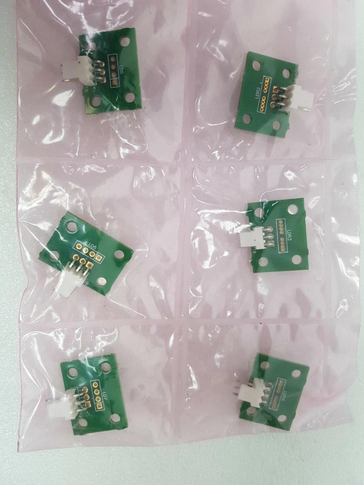 Six small LD/LDR boards with 3-pin connectors in a pink anti-static bag