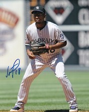 JONATHAN HERRERA   COLORADO ROCKIES   ACTION SIGNED 8x10