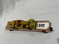 MENARDS Flatcar With a CAT ROAD SCRAPER  or EARTHMOVER  O Gauge