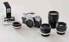 Minolta Sr-T102 35mm camera with Owner’s Manual and 3 lenses and accessories.
