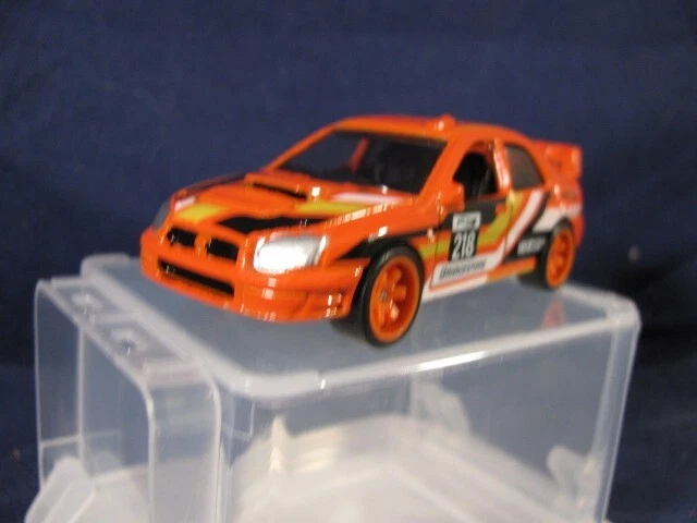 Subaru Impreza 2025 Orange Hot Wheels ligeramente pintado, con cambio de rueda de pilotos reales Foto 2 de 4