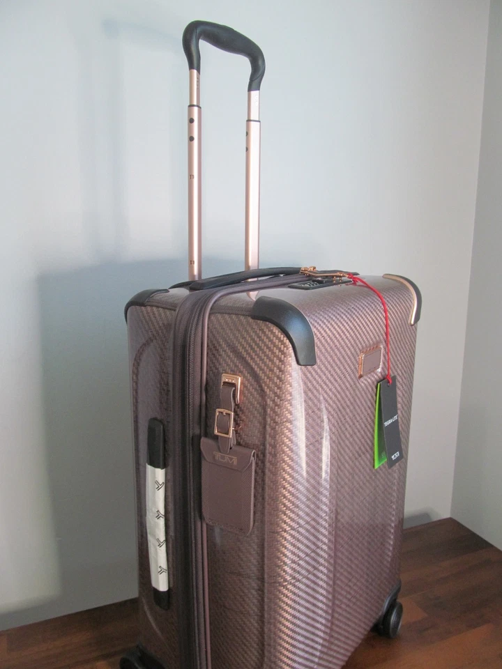 Hilandero de mano TUMI Unisex Global International Tegra Lite oro rosa $895.-NUEVO CON ETIQUETAS Foto 3 de 4