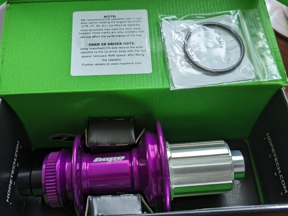 Buje trasero Hope RS4 142/12 mm bloqueo central disco CL carretera púrpura Shimano HG11 28h Foto 4 de 4