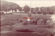 RPPC TWO MEN TALKING IN SUNKEN AREA IN PARK REPUBLICA ARGENTINA TARJETA POSTAL