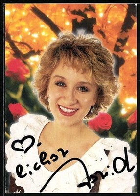 Singer Astrid Harzbecker in front of red roses, autograph, postcard 