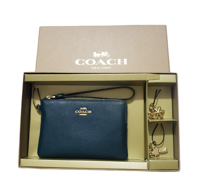 coach wristlet with charms