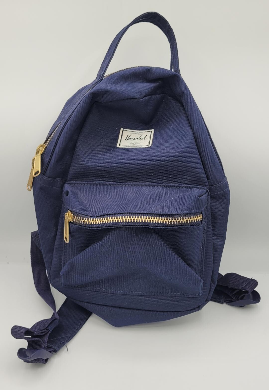 Herschel Nova Mini Arctic Backpack in Dark Blue with Red White Pinstripe Interior