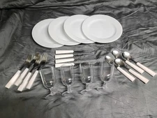 4 setting plastic picnic set plates, silverware, cups