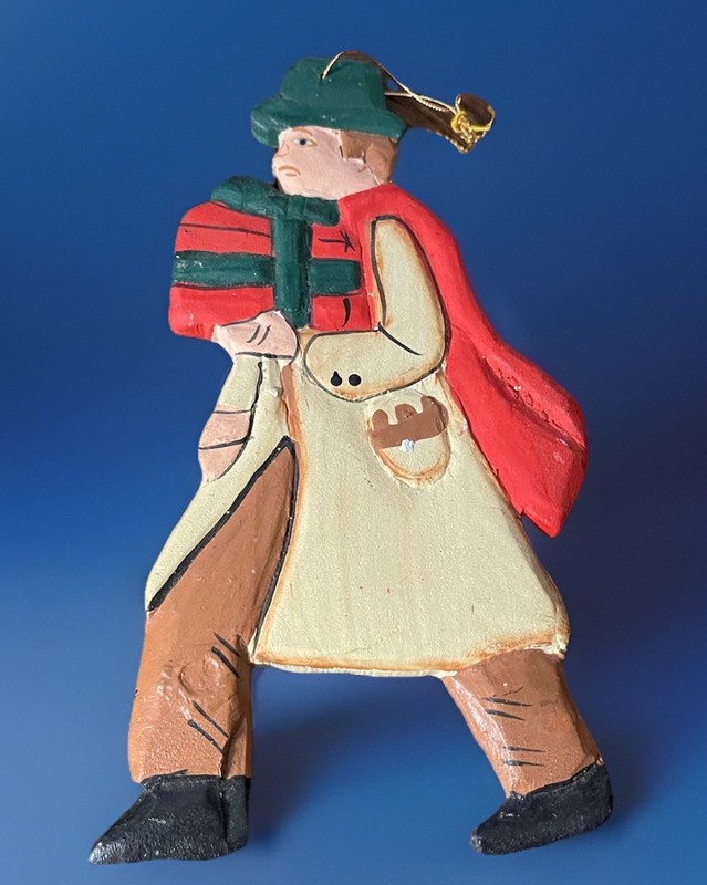 VINTAGE HAND CARVED AND PAINTED ORNAMENT OF MAN CARRYING PRESENT MADE IN HAITI