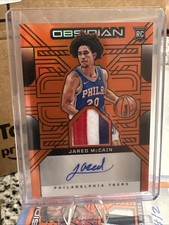 2024 Panini Obsidian Jared McCain (RC) Rookie Jersey Ink Orange Flood 99/99 RPA