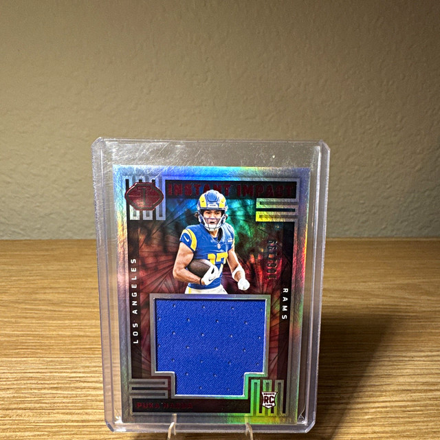 Panini 2023 Illusions Puka Nacua Instant Impact Red /199 RC MEM #II-PNA Rams