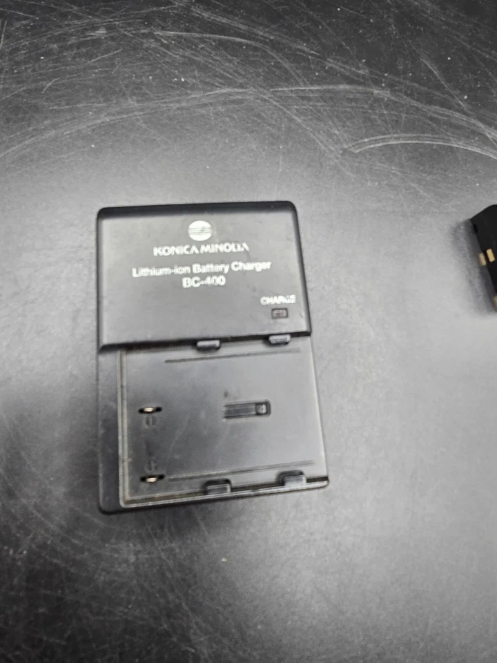 Cargador de batería de iones de litio Konica Minolta BC-400 para Dynax/Maxxum + batería Foto 2 de 3