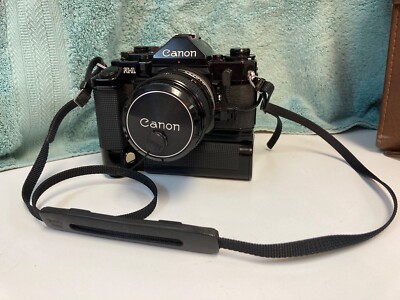 Canon A-1 Camera FD w/Motor Drive, 24mm2.8 Lens, Sky 55mm Filter A