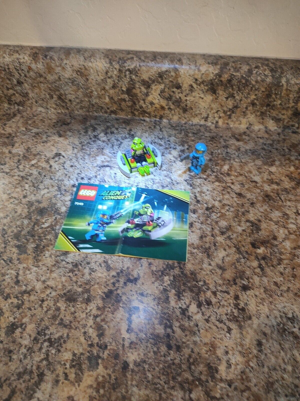 LEGO Space Alien Striker (7049) complete Folded Book And Slight Character Crack.