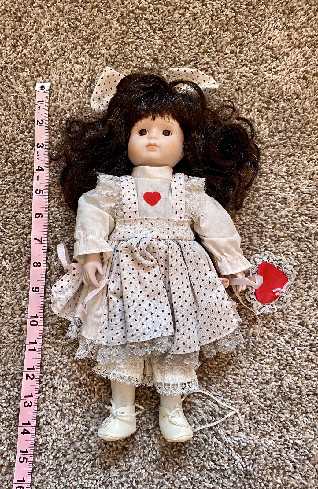 Porcelain Doll Holding Heart
