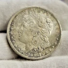 1885 O  US Morgan Silver Dollar $1 AU (Toned)