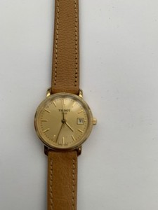 Authentic Tissot T825/925 Gold Plated Gold Dial Ladies Watch With Brand Tissot Strap.