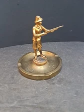 ❤️ Vintage Dodge Inc Trophy Ashtray Lady Shooting Gun Brass/Bronze ?