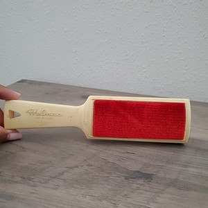 Helmac Magik Brush, a double-sided lint and pet hair remover