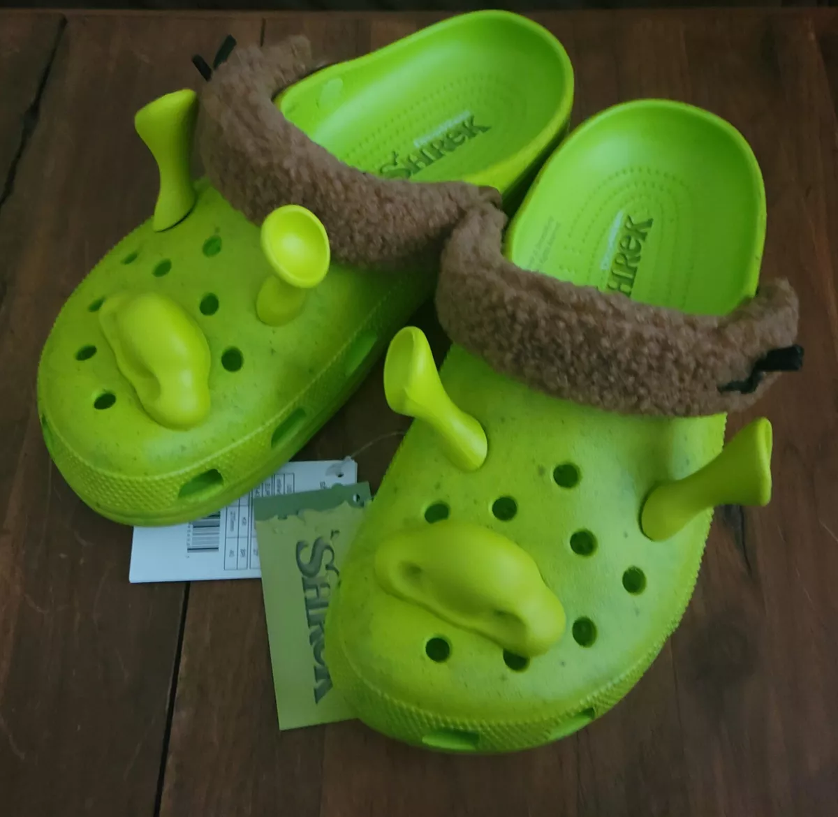 Crocs has teamed up with the Shrek franchise to craft an incredibly  authentic Shrek Classic Clog. 🟢🟤 This unique footwear faithfully…