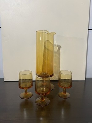vintage Luminarc Cavalier amber glass stemware and a matching pitcher