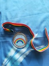 Thank you rainbow medals presented on rainbow ribbon