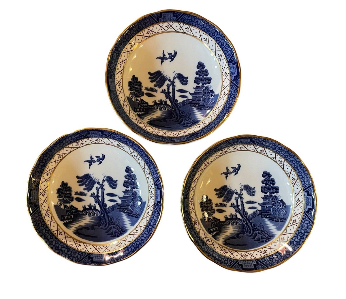 A collection of Booths 'Real Old Willow' pattern tablewares, including fourteen dinner pla