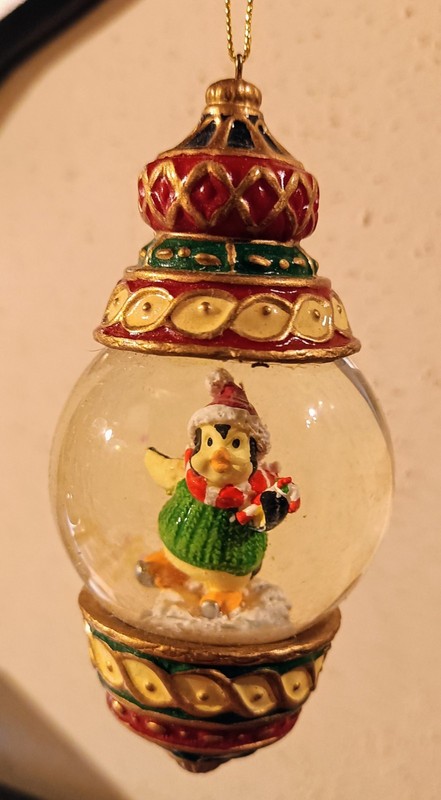 Kirkland Skating Penguin Snow Globe Christmas Ornament.