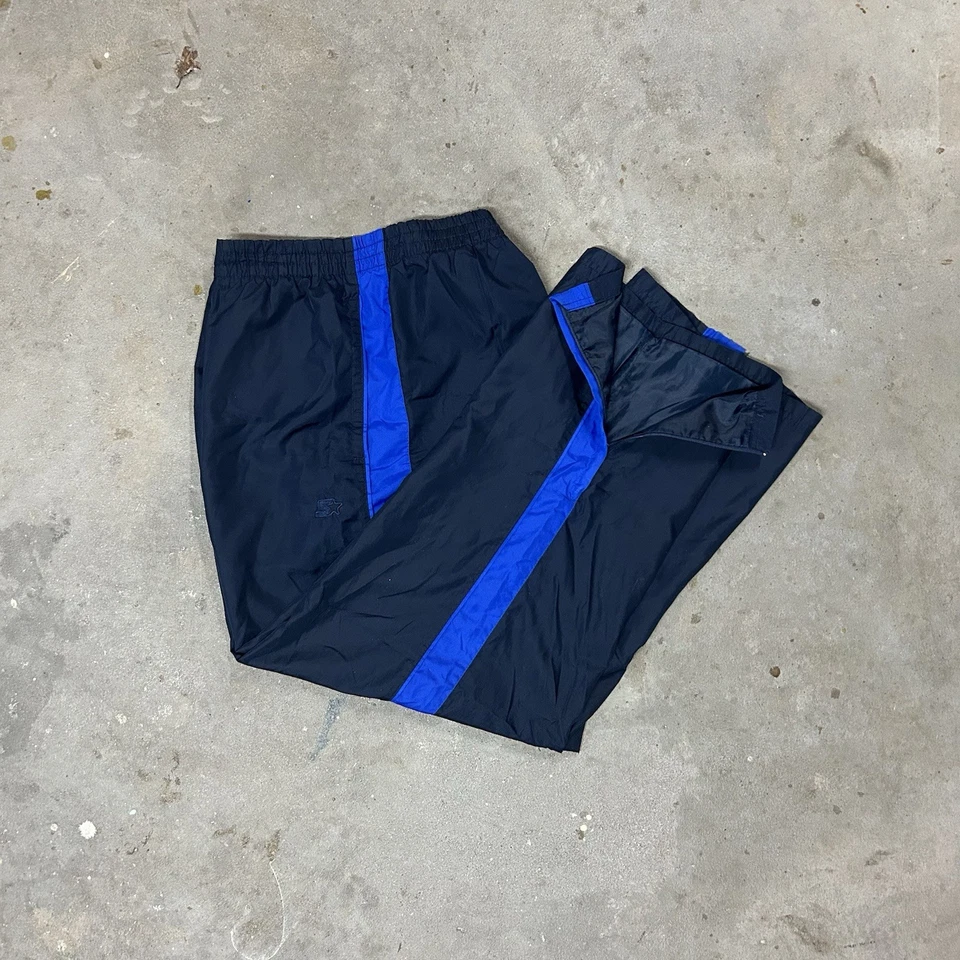 Pantalones deportivos cortavientos vintage Starter para hombre forrados en malla L pierna ancha azul Foto 2 de 4