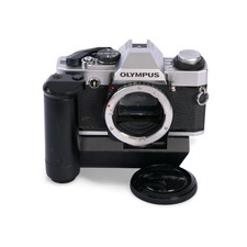 Olympus OMG Chrome 35mm Film SLR Camera. S/N: 1079079  OM Winder 2. S/N: 705915