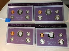 Lot 1984,1985,1986,1987 Proof Set With Box Holder Slight Blemish Back Of 87 Case