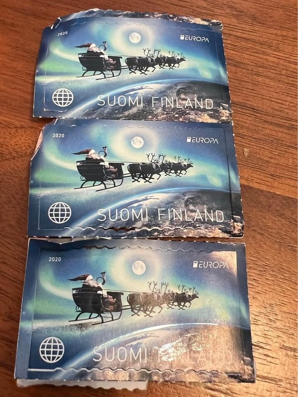 Air mail stamps from Finland, northern lights, Santa