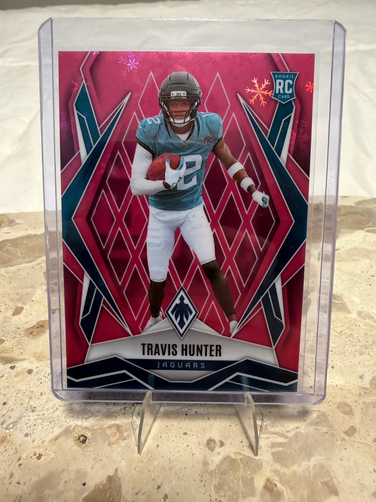 2025 Panini Phoenix - Jaguars RC Travis Hunter 157 Winter Pink 121/299 Mint