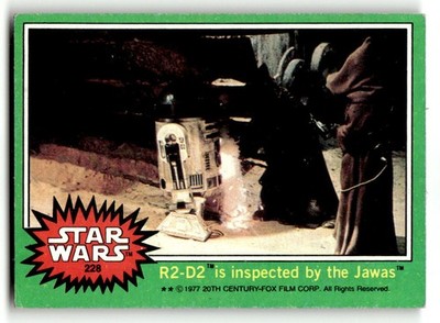 1977 Topps Star Wars #228 R2-D2 is inspected by the Jawas