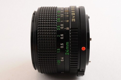 【CASI COMO NUEVO+】CANON NEW FD NFD 24mm F/2.8 MF Lens Cap + 1984 OLYMPIC... - Imagen 7 de 12