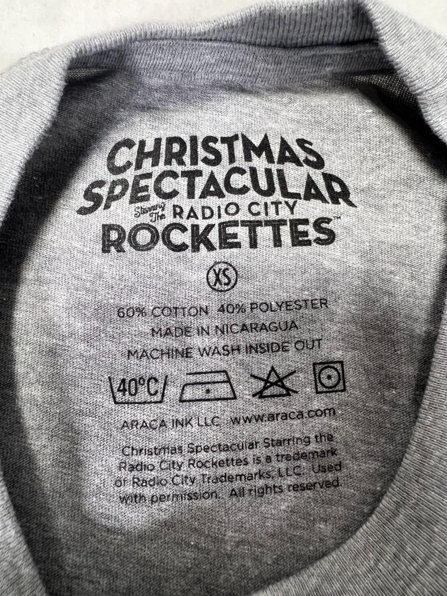 The Radio City Rockettes CHRISTMAS SPECTACULAR SKYLINE TEE T The Radio City Rockettes CHRISTMAS SPECTACULAR SKYLINE TEE T