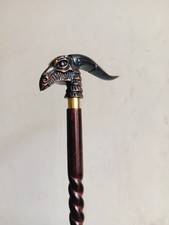 Elegant walking stick, twisted cane, wood and metal, black and silver Designer