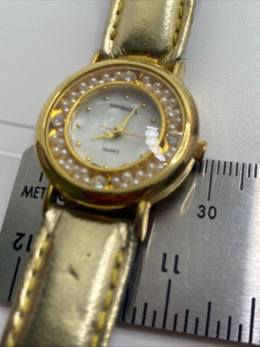 Vintage Ladies gold tone mother of pearl floating crystals watch NEW BATTERY Shannos Womens Elegant Gold Tone Floating Pearl Watch Works  main image 4