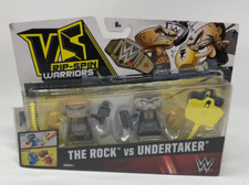 Mattel WWE VS Rip-Spin Warriors The Rock VS. Undertaker paquete de 2 juguetes de lucha libre