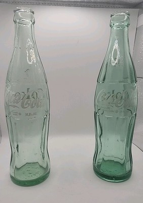 2 Different Vintage Coke A Cola Bottles 12oz