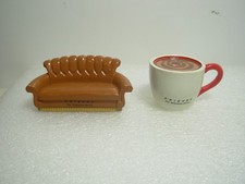 Two Ceramic Ornaments In The Form Of The Couch And Coffee Cup. FRIENDS