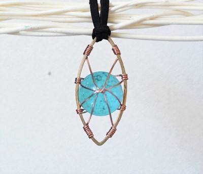 Wire Wrapped Turquoise Colored Glowing Stone Pendant