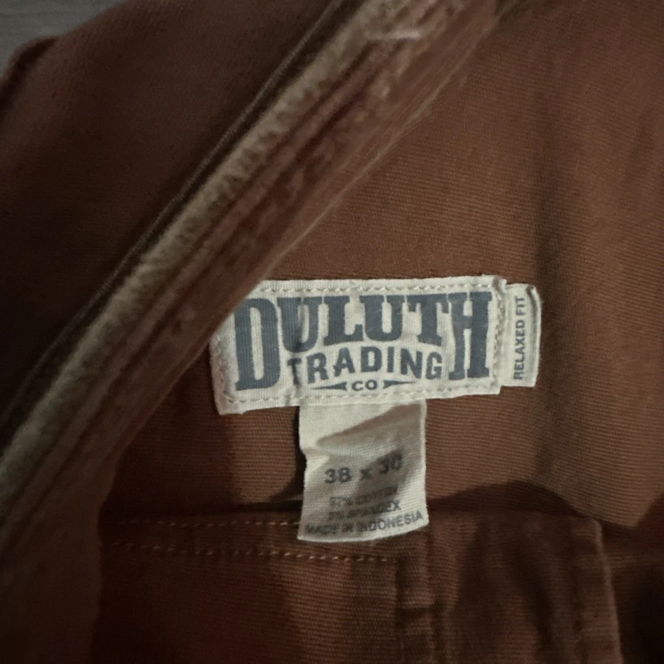 Pantalones comerciales Duluth para hombre 38x30 manguera flexible contra incendios para hombre ajuste relajado naranja utilitario Foto 3 de 4